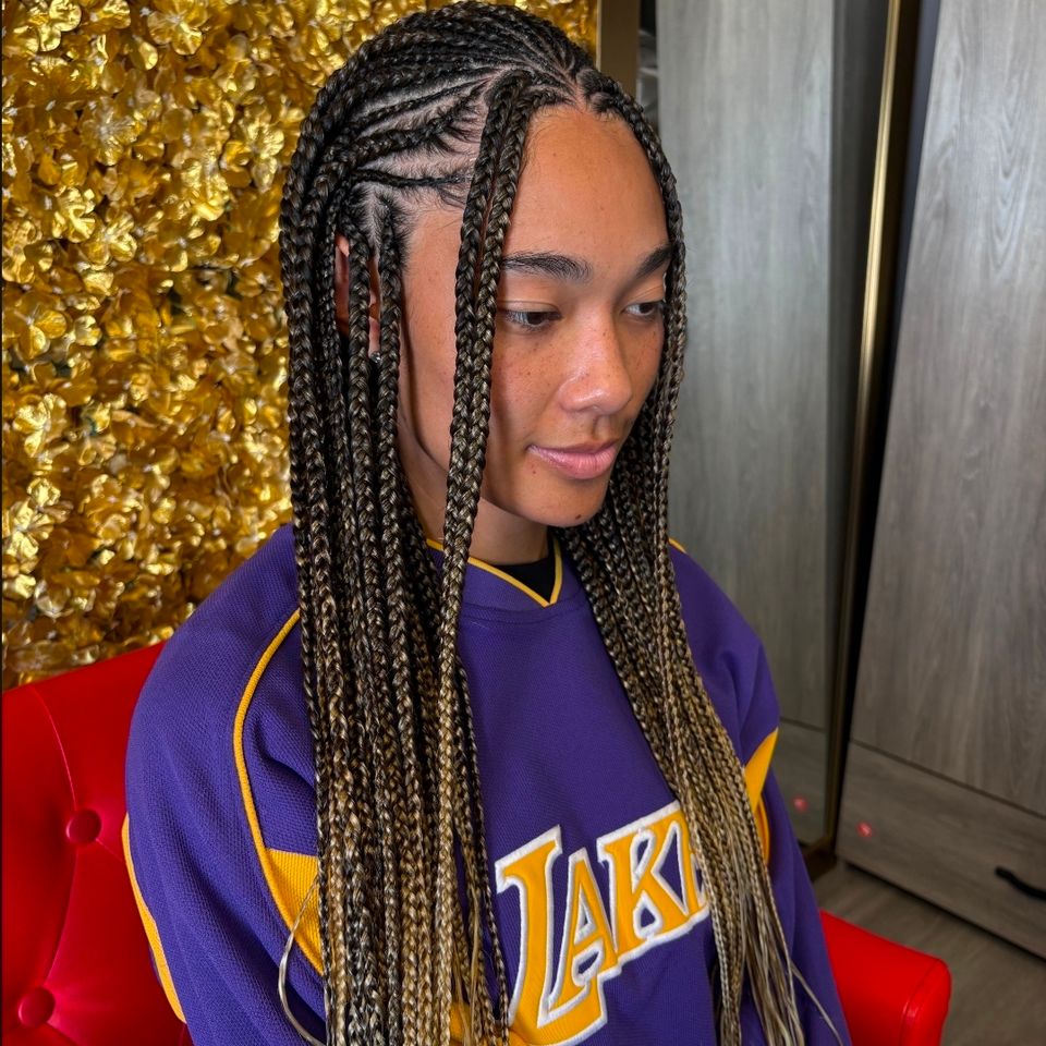 Fulani style cornrows into knotless braids styled on a client in Los Angeles CA