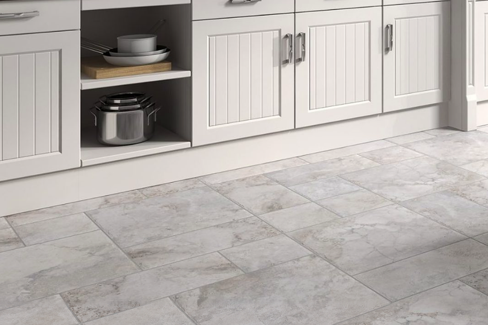 Gray tile kitchen floor white cabinets