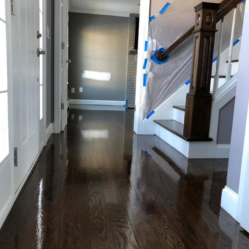 Dark hardwood hallway and staircase