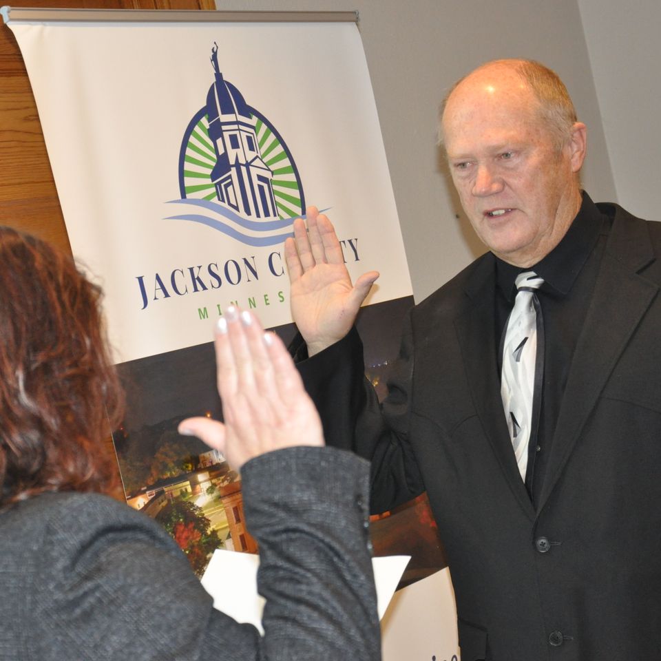 Fifth Judicial District Court Judge Darci Bentz administers the oath of office to Kent Bargfrede, newly elected District 1 Jackson County commissioner, on Jan. 7 in Jackson. Photo by Justin Lessman
