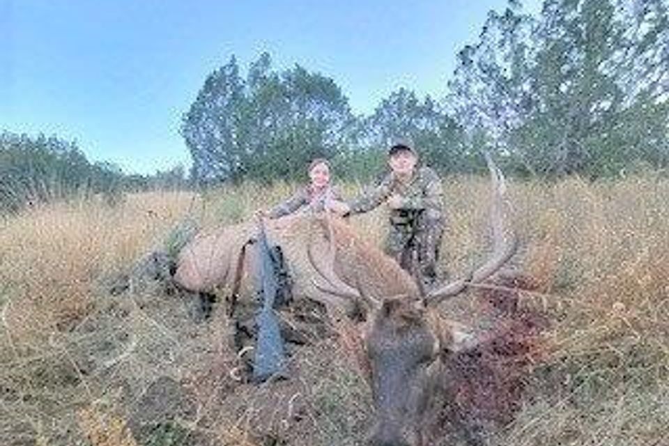 Tim's son brayden and his daughter hannah with her first day bull