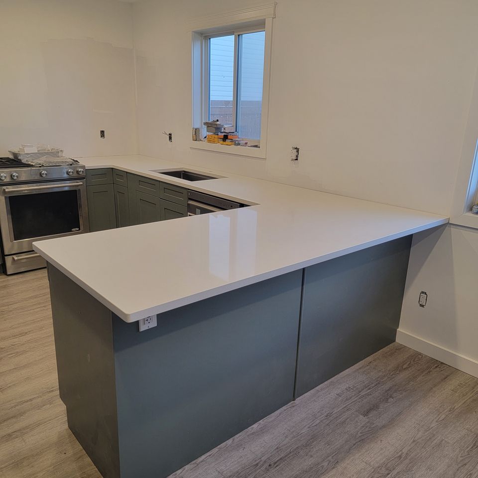 White countertop with grey cupboards