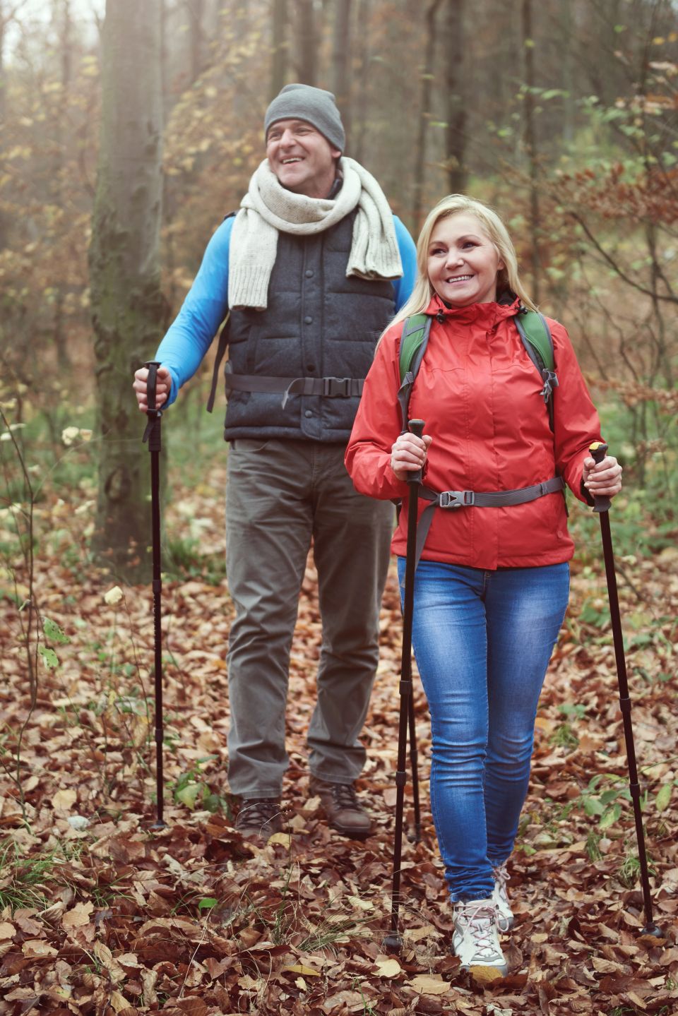Woman and man hiking in the woods showing great energy