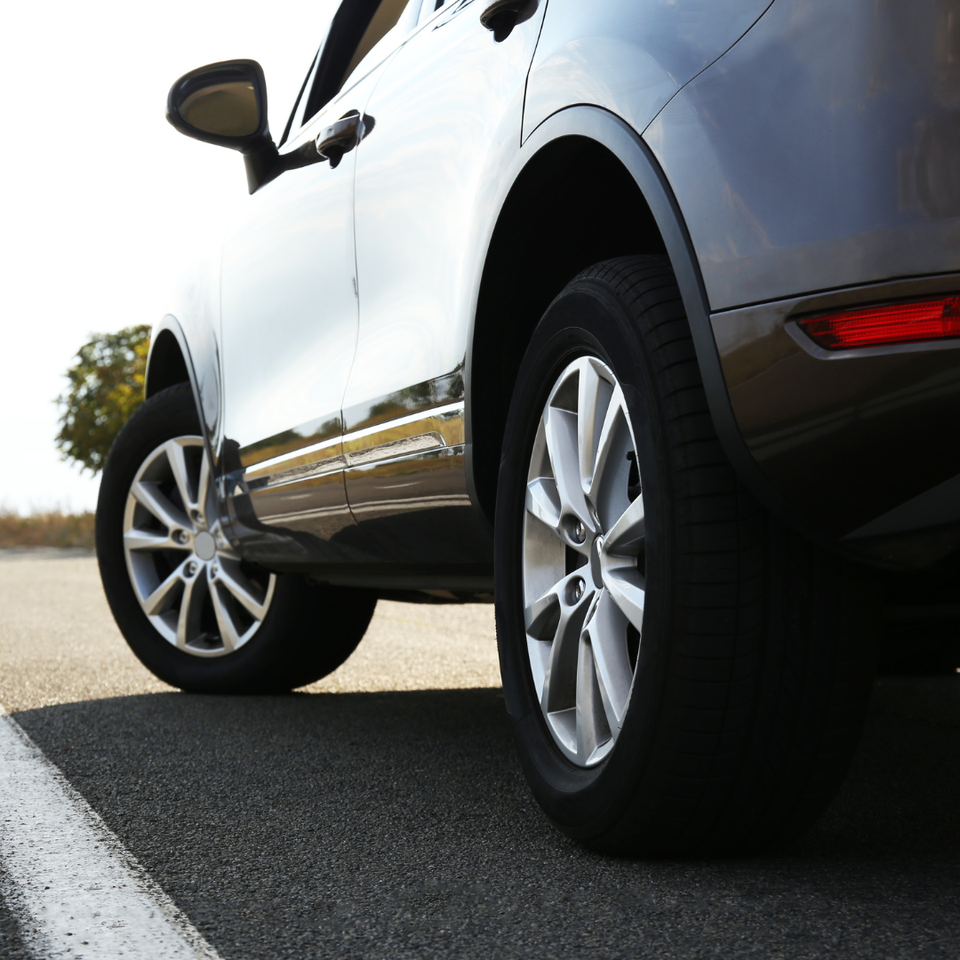 Close-up of a vehicle parked on the road, representing professional automotive repair and maintenance services.