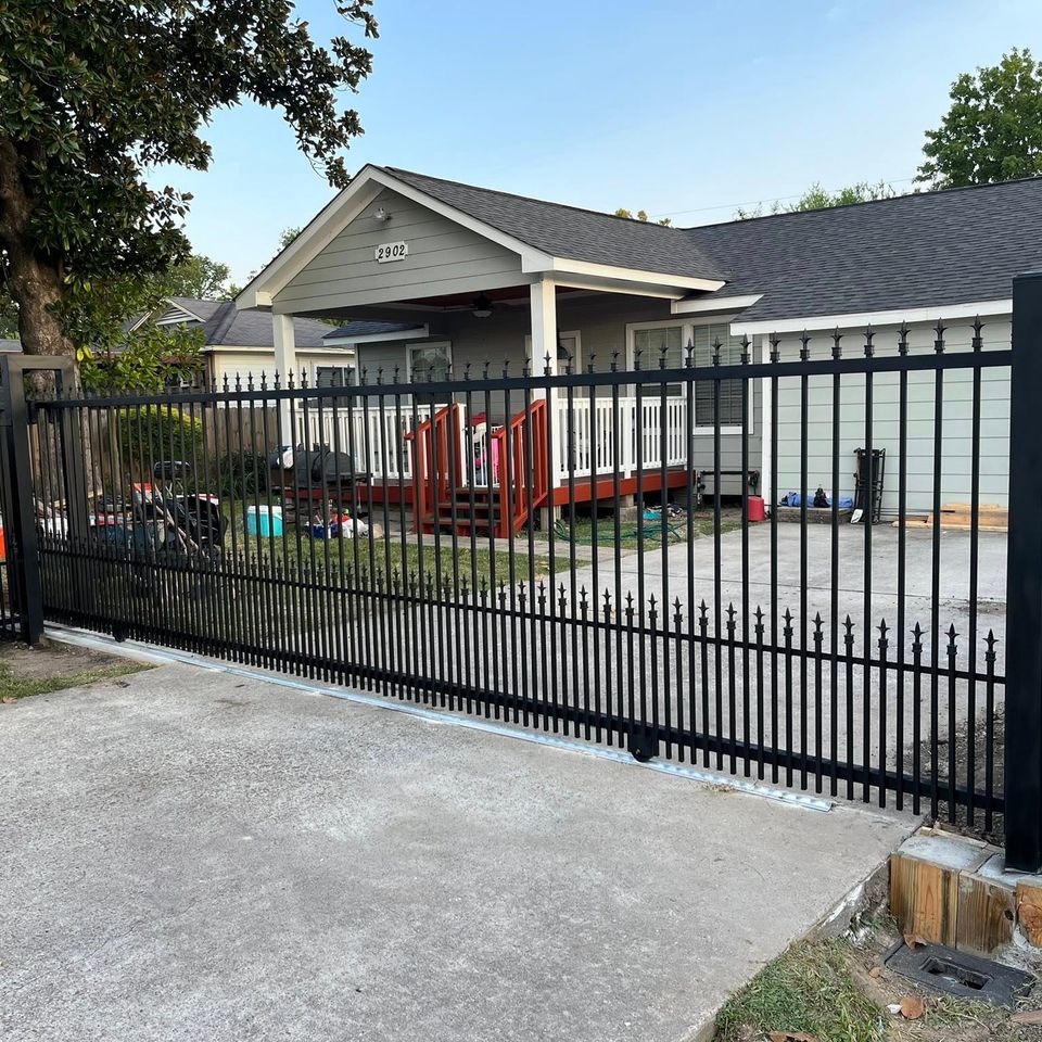 Custom iron driveway gate designed and welded for strength and style. Built in Houston with premium materials for long-lasting performance.