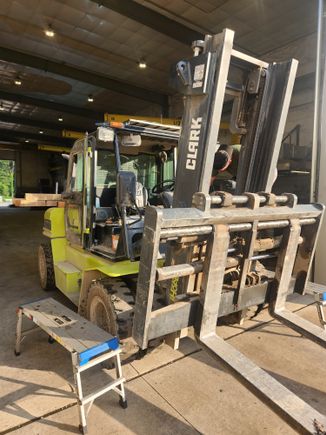Heavy-duty commercial truck inside an auto glass shop for professional windshield and glass replacement.