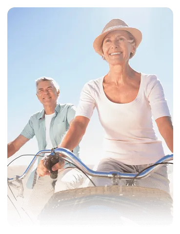 Senior couple riding bikes
