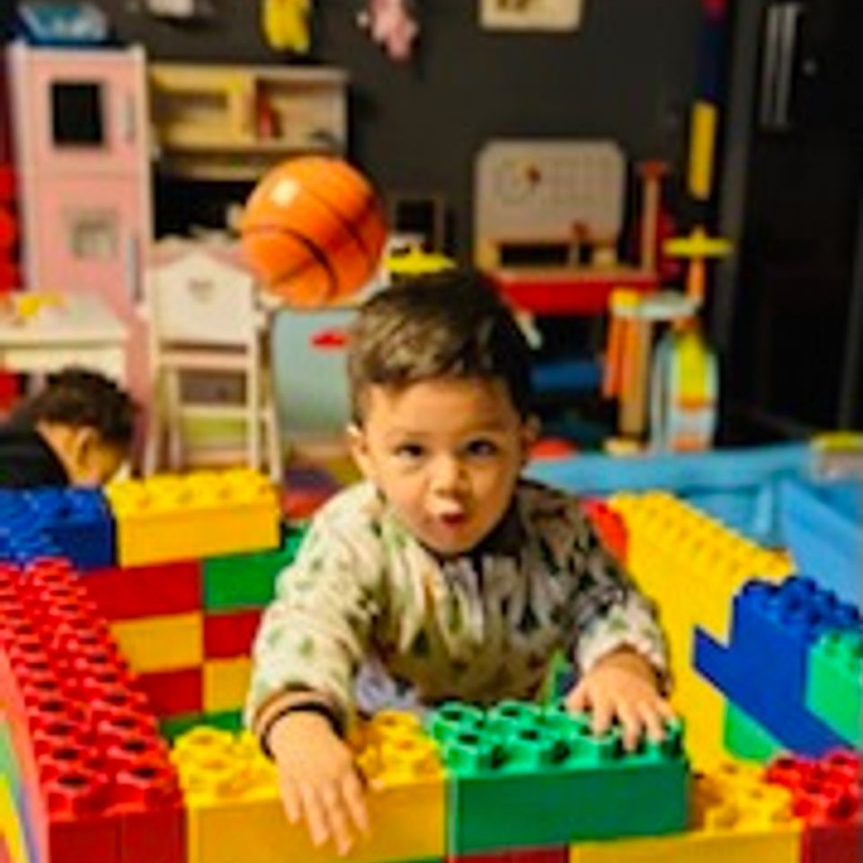 Boy with blocks brenda's family daycare