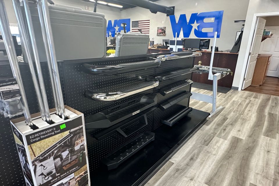 Truck accessories showroom featuring bed racks and storage solutions at Patriot Truck Accessories in Hot Springs Arkansas