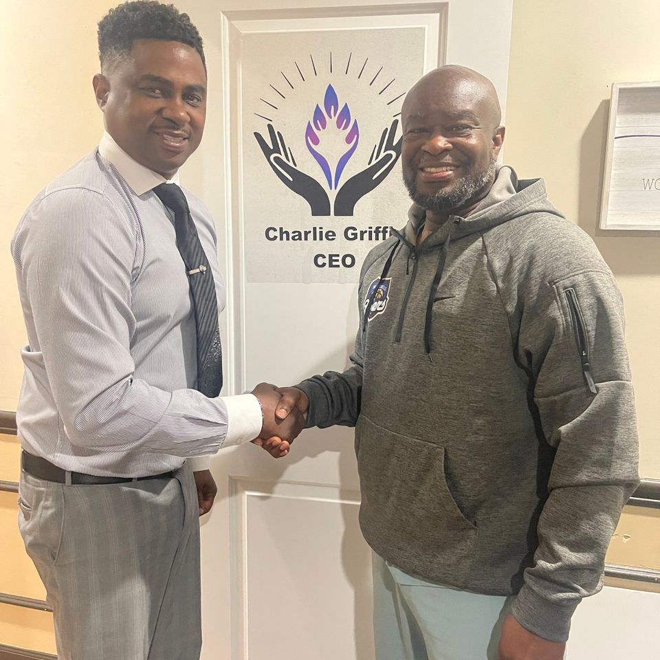 Jacksonville 95ers Owner Kevin Waters shaking hands with a sponsor