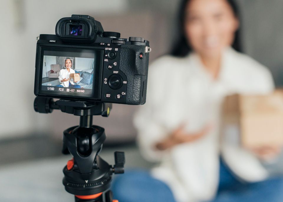 Blurry woman live streaming home