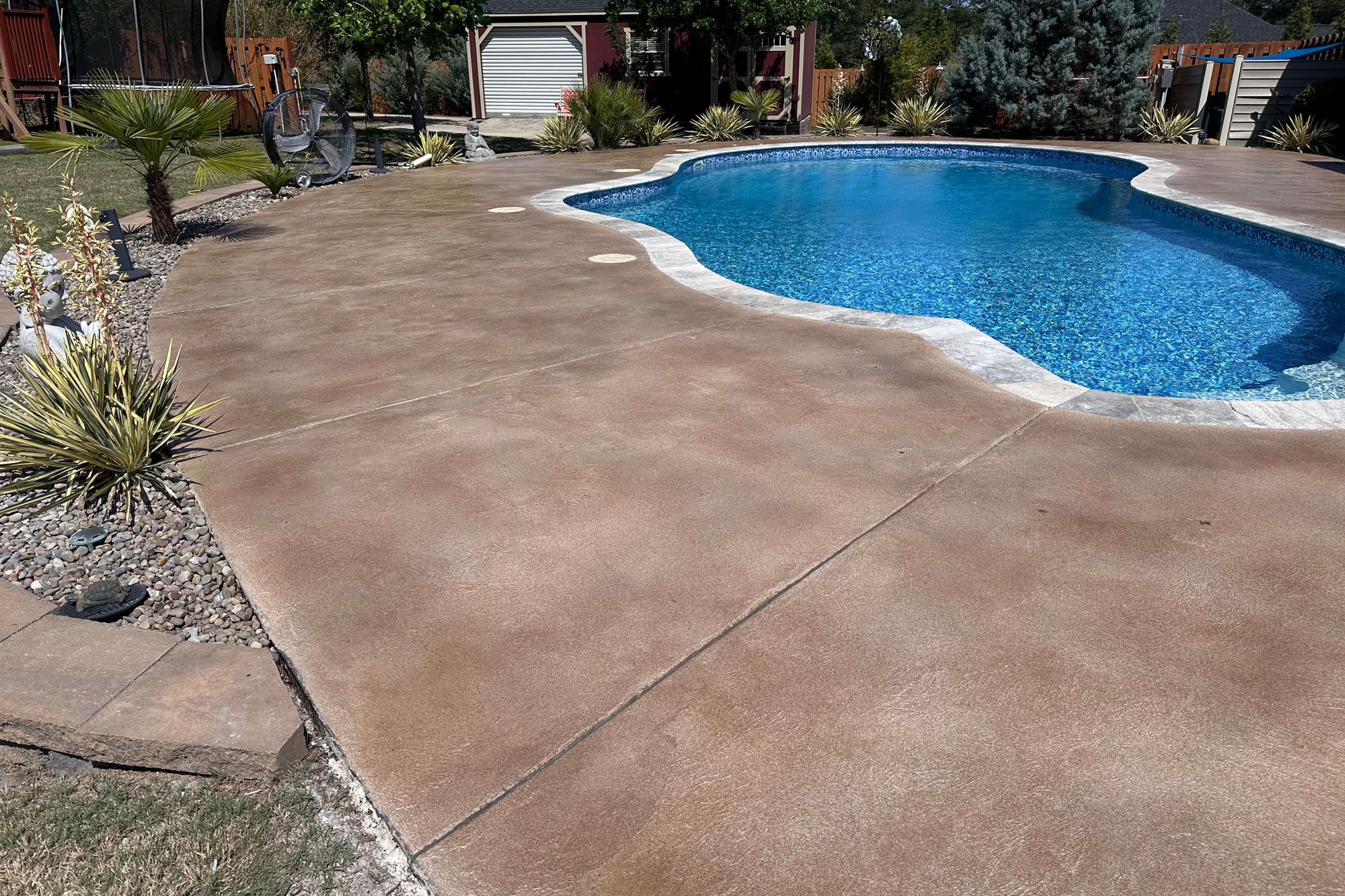 Beech Island SC pool deck with warm decorative concrete finish