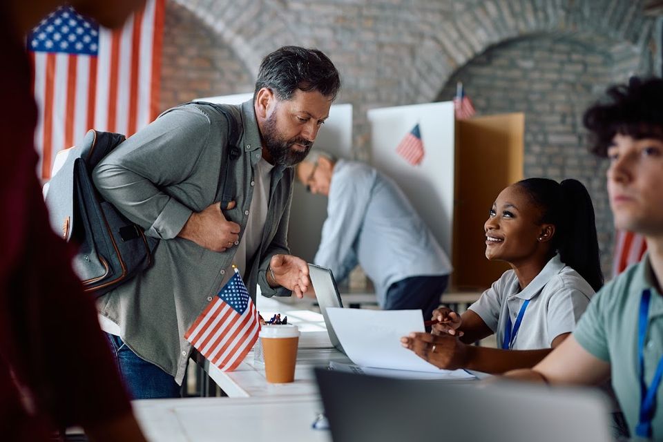 Happy black volunteer talking to a voter during us 2024 02 29 05 12 43 utc 1